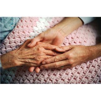 Photo graphic of younger hands holding elderly hands
