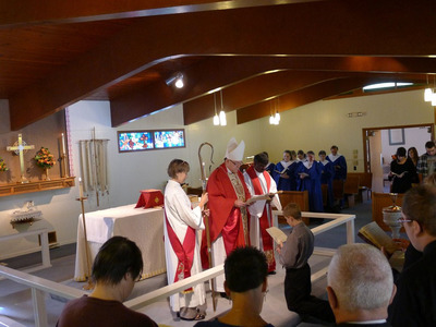 Bishop Terry Allen White assisted by Rev. Paul Collins and Deacon Delinda Buie 