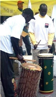 Deacon Daniel Kuol plays drums at a Sudanese service