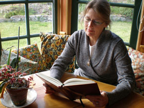 Photo of spiritual author Paula Huston at her desk