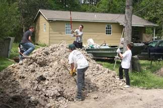 Young men with St. Thomas helped build a garden on spring break mission trip