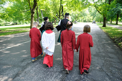 Bagpipers lead procession with acolytes in front