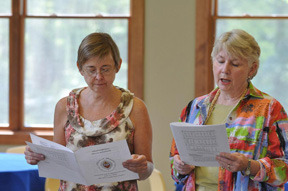 Graduates Cam Norman and Dru Kemp are seen singing a hymn