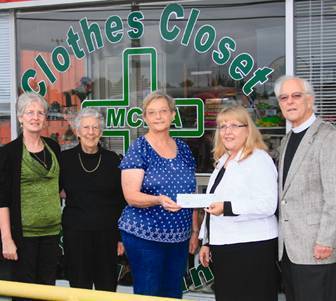 Holy Trinity members with director of Meade County clothes closet and food pantry