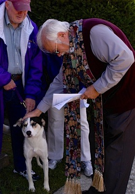 Rev Karl Lusk blesses a member's year-old dog at Ascension