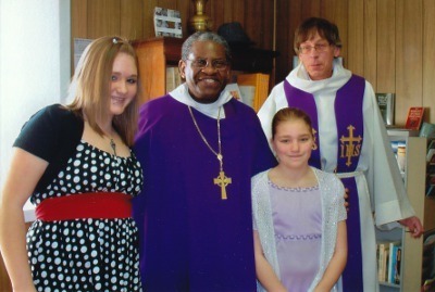 Bishop Baxter and Fr. Johnston with two young members