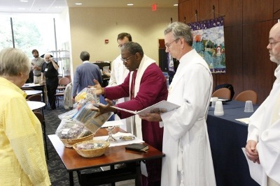 Bishop Baxter blesses prayer shawls