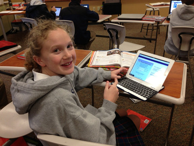 Sixth Grader Lauren Lorenz in class with her iPad
