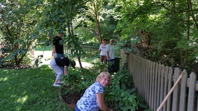 The group cleaning up and weeding