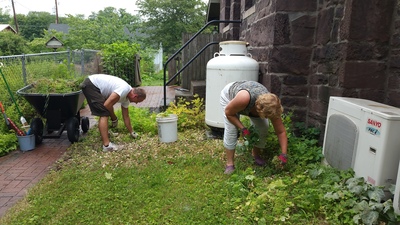 Weeding the North side of the church...