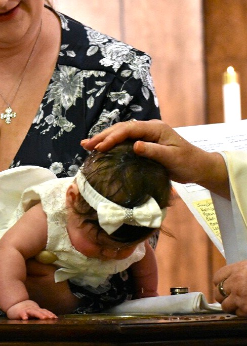 Baby being baptized