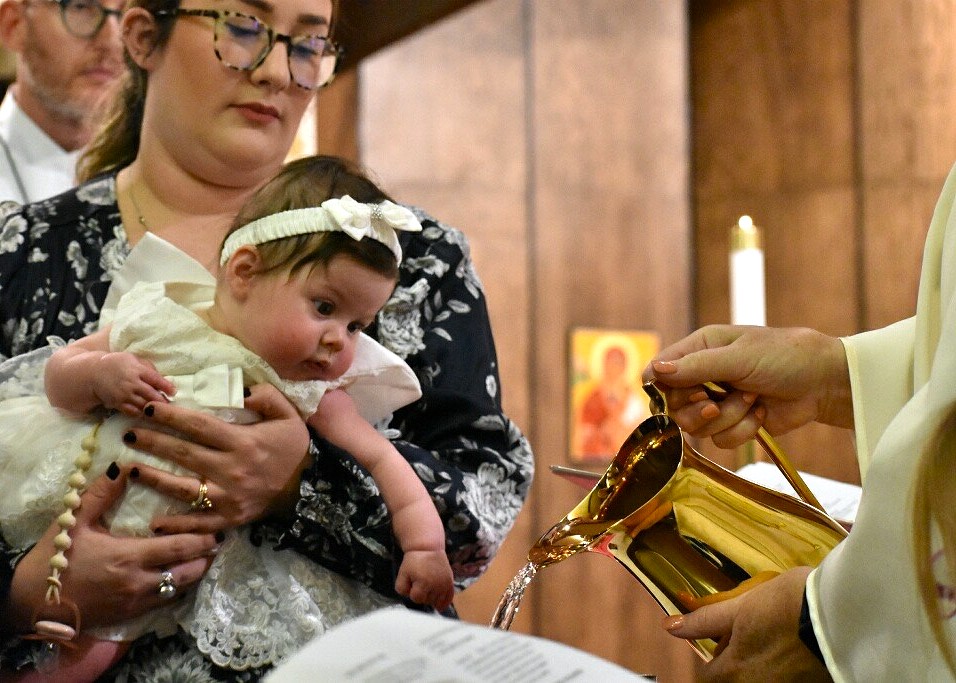 Baby watching baptismal font