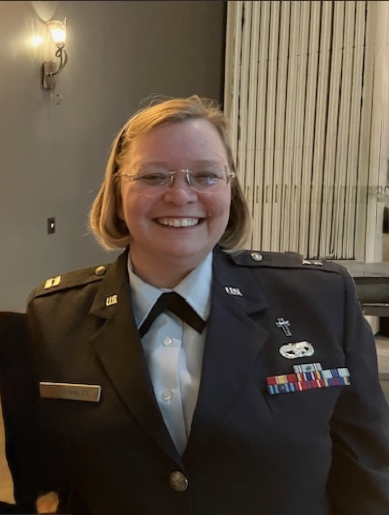 Mother Ginger in military uniform serving as Chaplain