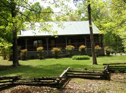 The log house purchased by the church in 2003.