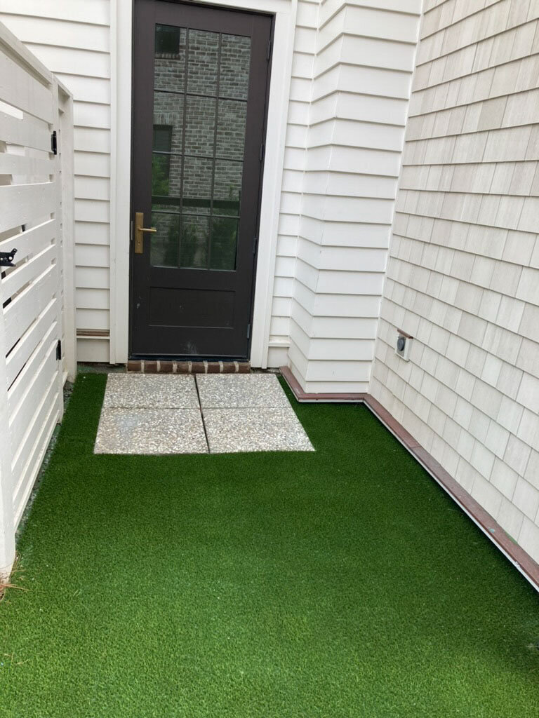 Artificial turf backyard pet entrance