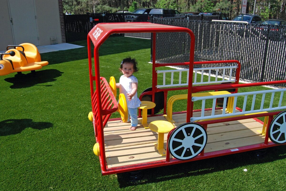 Synthetic grass commercial playground truck