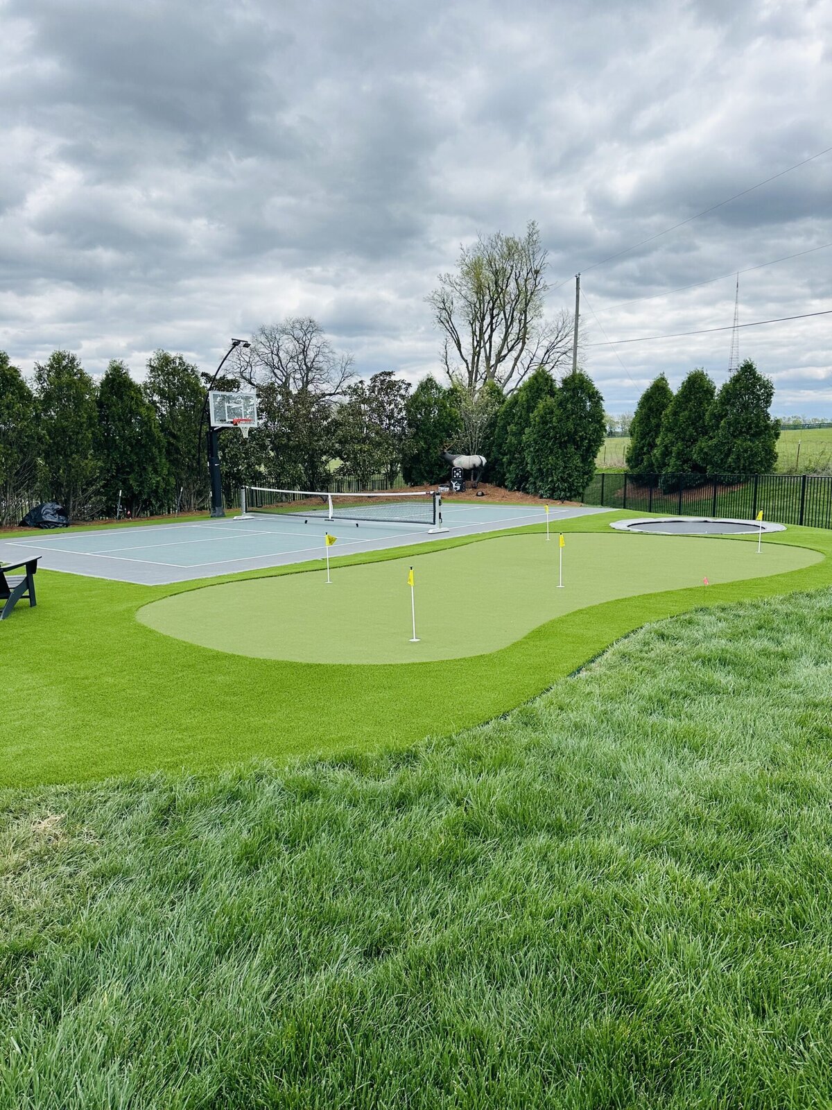Complete Backyard with Putting Green Court and Trampoline