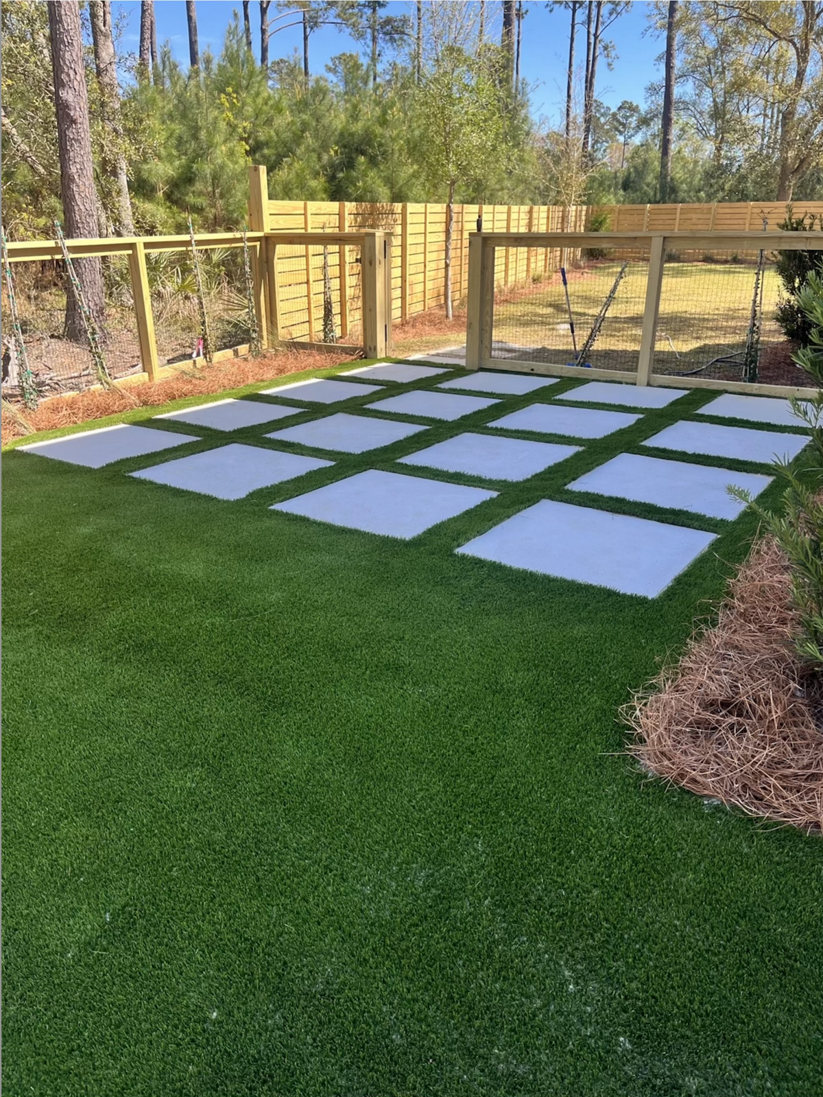 Artificial Grass Backyard with Concrete Tiles Charleston