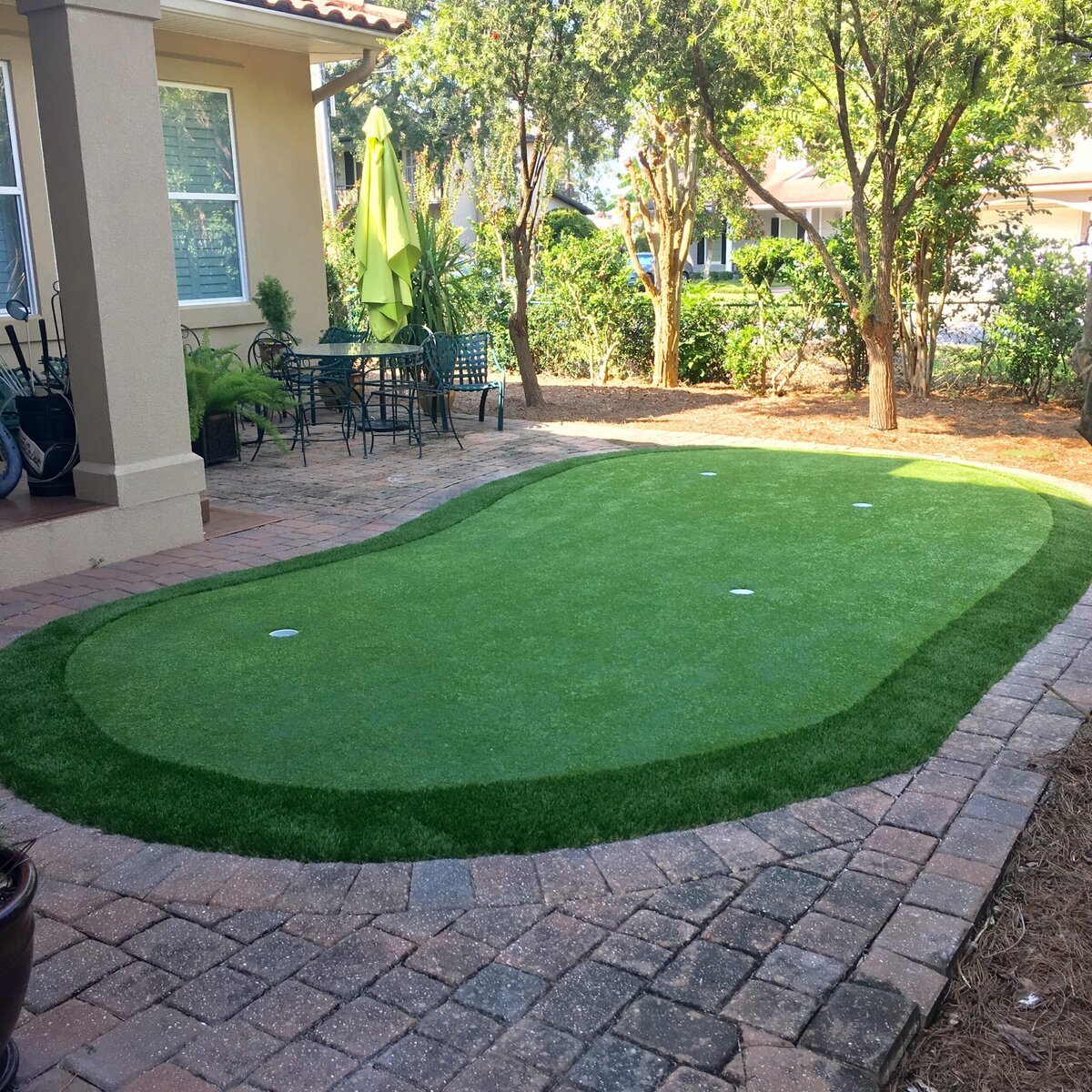 backyard putting green jacksonville with paver patio