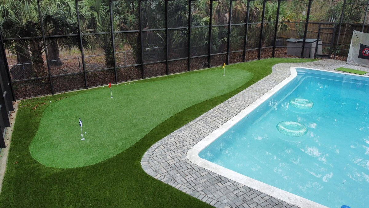 Backyard Putting Green Next To Pool In Jacksonville 3 Color Flags
