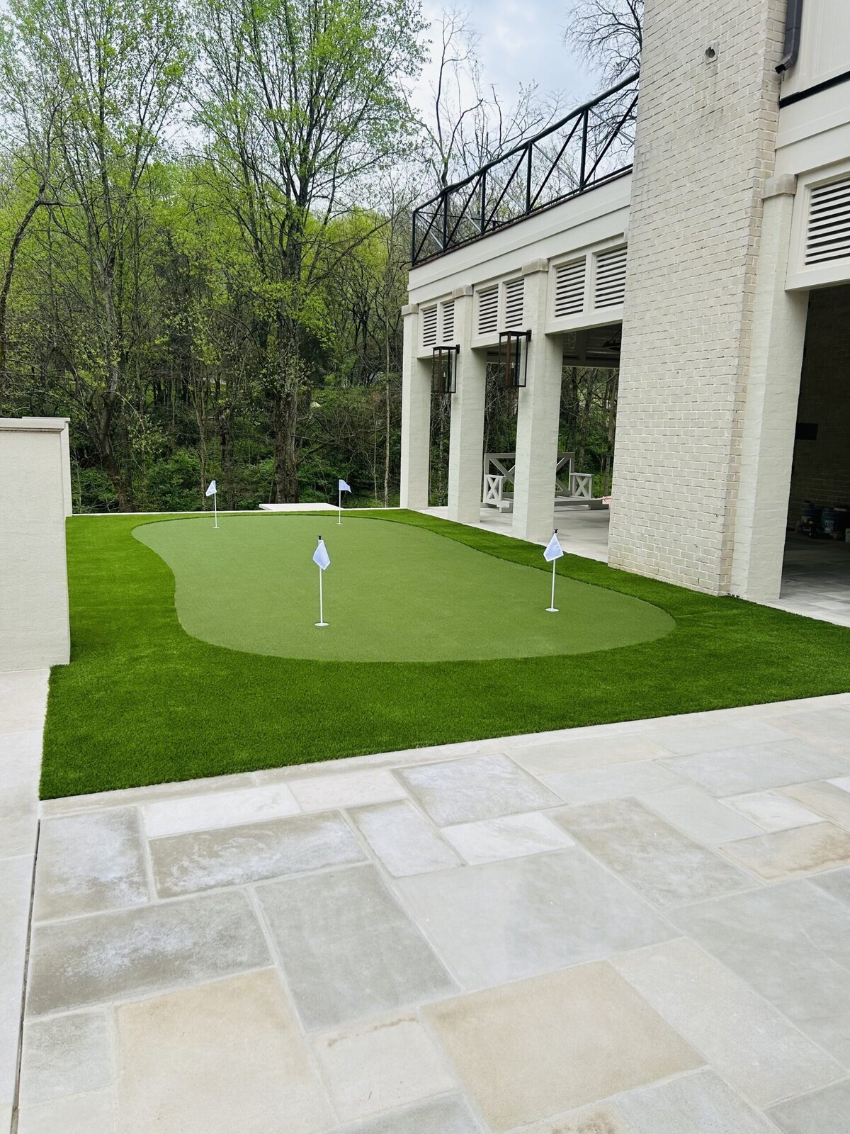 Backyard Putting Green with Fringe Turf Off Outdoor Kitchen Nashville