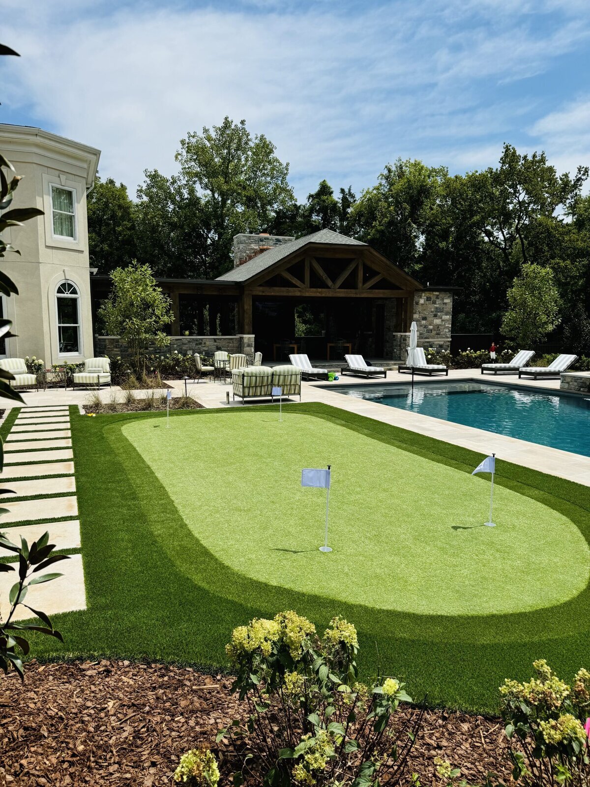 Perfect Backyard Putting Green with Fringe and Lawn Next to Pool Nashville