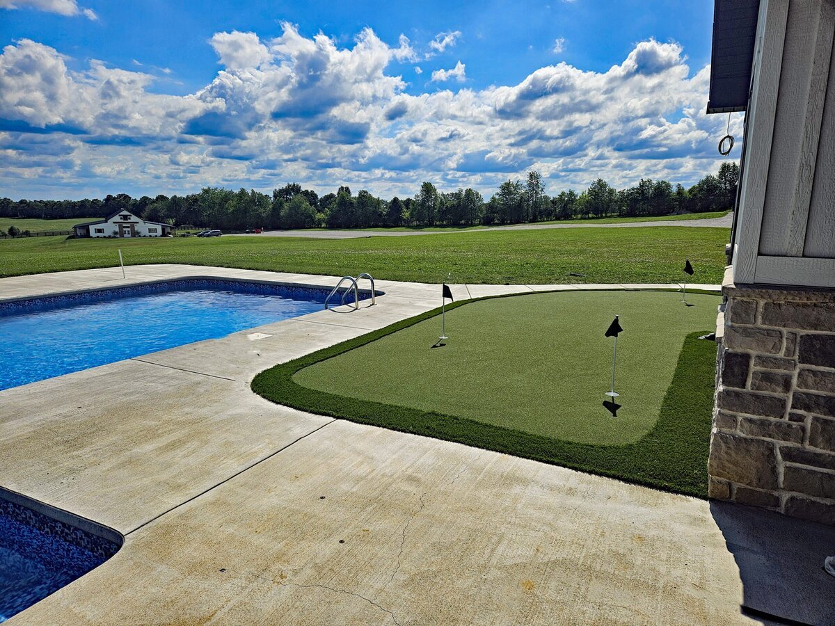 Backyard Putting Green Next to Pool Deck
