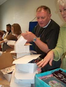 The Rev. Jim Wilkinson packs Easter boxes for Seamen's Institute Ministry on River