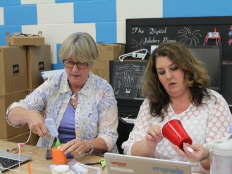educators making artbots at a table