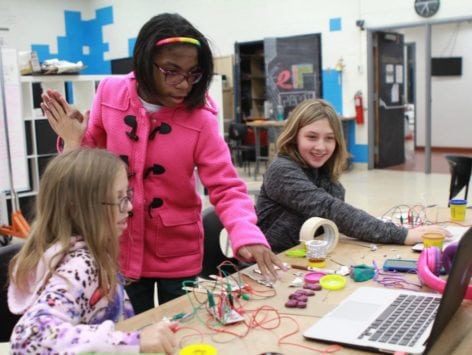youth working with makey makey at a table