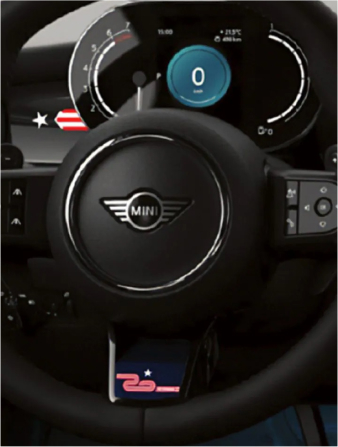 Closeup view of a nappa leather steering wheel with 20 Years Edition insert and paddle shifters.