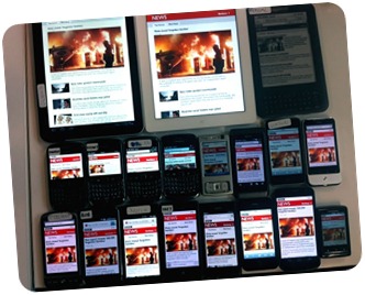 Many smartphones and tablets on a table displaying the same app.