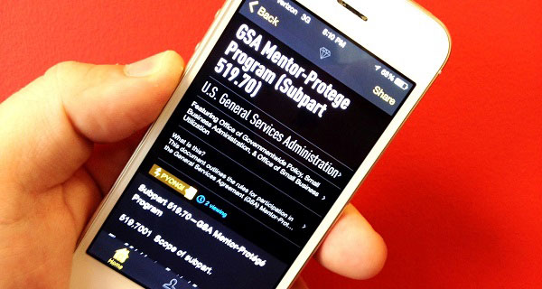 Photo of a mobile phone displaying the Rap Genius app