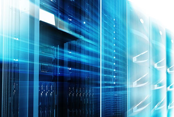 Mainframes cluster with control terminal in data center with a motion blur filter.