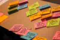 Different colored sticky notes from an agile project planning session.