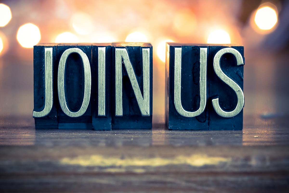 The words Join Us are spelled out with vintage metal letterpress blocks.