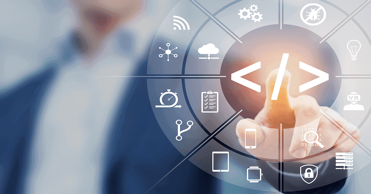 A developer touches an augmented reality screen of technology icons.