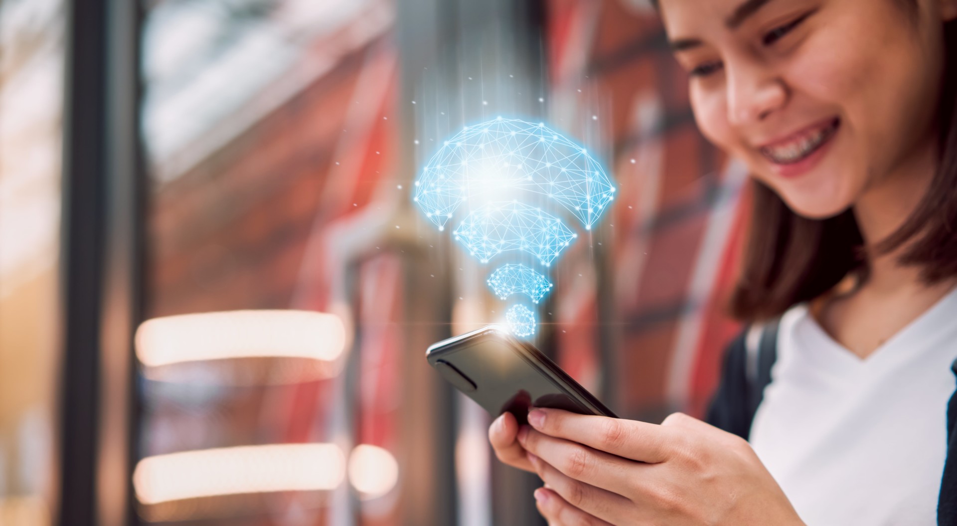 wireless-connection-network-technology-smiling-asian-woman-using-smartphone-show-wifi-icon-mall-min wireless-connection-network-technology-smiling-asian-woman-using-smartphone-show-wifi-icon-mall-min