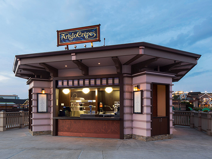 AristoCrepes kiosk illuminated at dusk