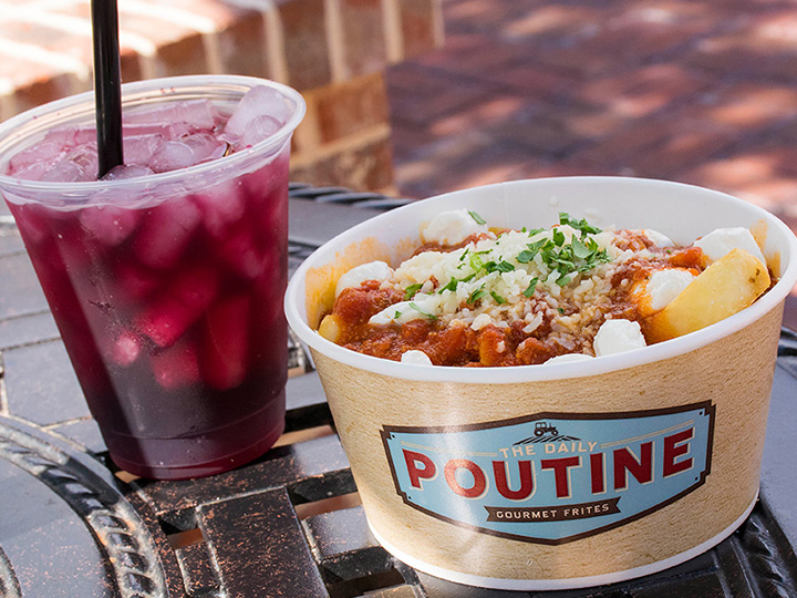 A serving of poutine and a cup of fireball sangria