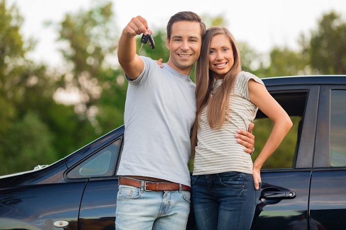 Couple shopping for vehicle at a used car lender in Bucks County