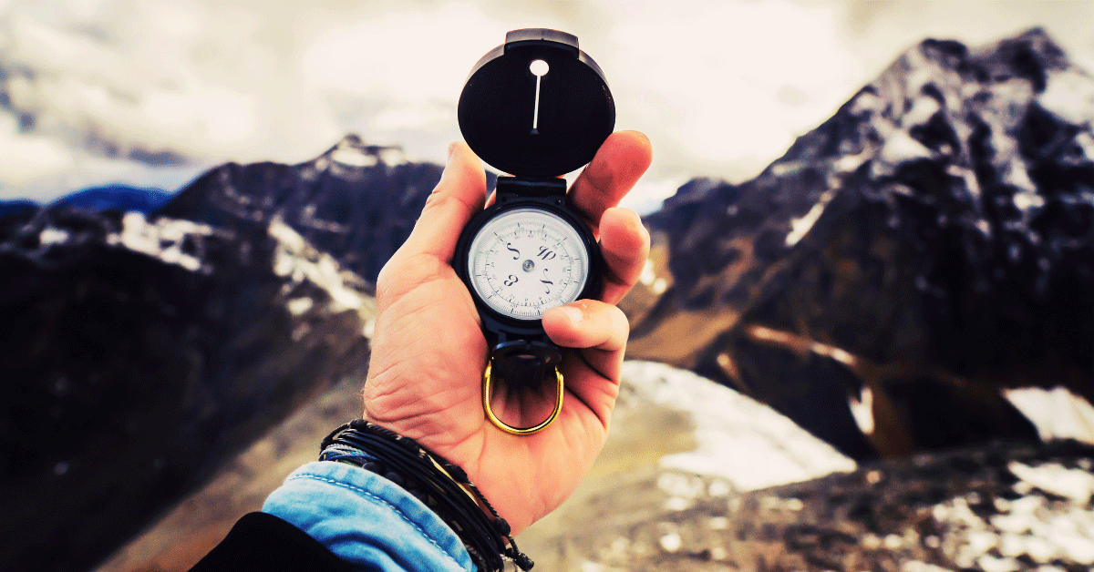 man's hand putting fruit on a scale