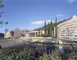 Sprawling white building surrounded by mountains of West Hills