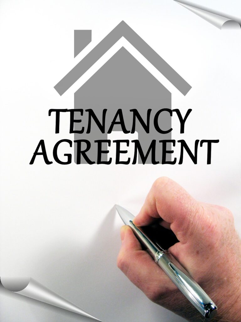 A tenancy agreement with someone signing the contract