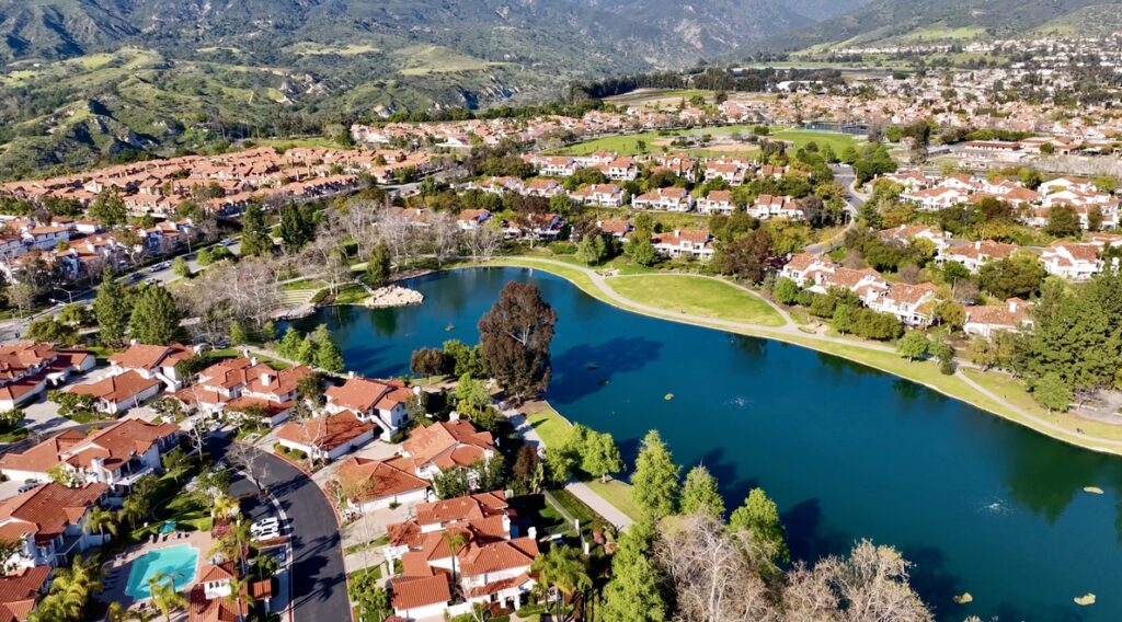 Orange County Homes for sale, Rancho Santa Margarita Lake Condos, Townhomes, and homes with mountains in background