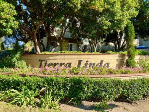 The Rancho Santa Margarita Tierra Linda condos, complex located over by Tijeras Creek Golf Course. Some have views of the golf course, some of the trails. The sign, landscape, and condos, in RSM, Rancho Santa Margarita
