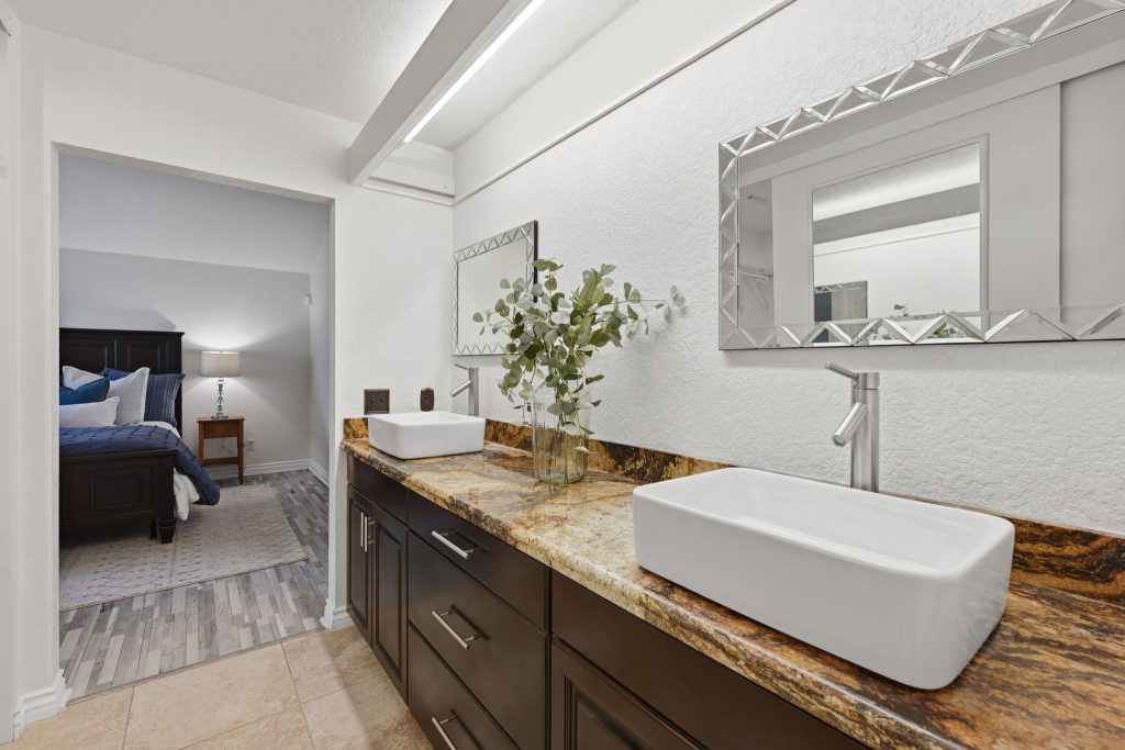 Primary suite with upgraded ensuite bathroom with walk-in closet and private patio
