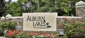 An entrance sign for Auburn Lakes community in Spring Texas