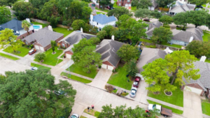 Steeplechase neighborhood with single-family homes, neatly manicured lawns, and tree-lined streets.