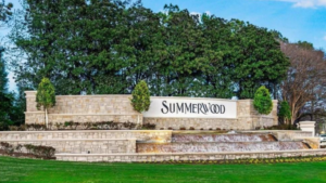 A grand stone entrance of the Summerwood community in Houston Texas